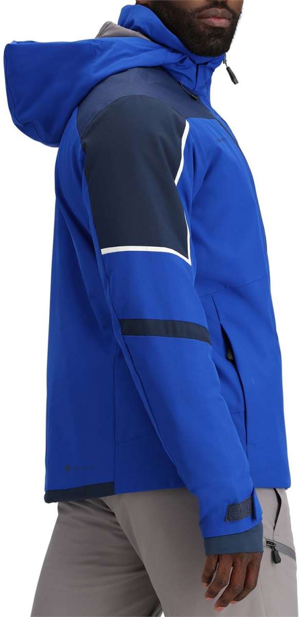 Obermeyer Foundation Insulated Jacket Tall 2024 - A royal blue jacket with a navy-blue stripe on the chest and white trim around the hood.