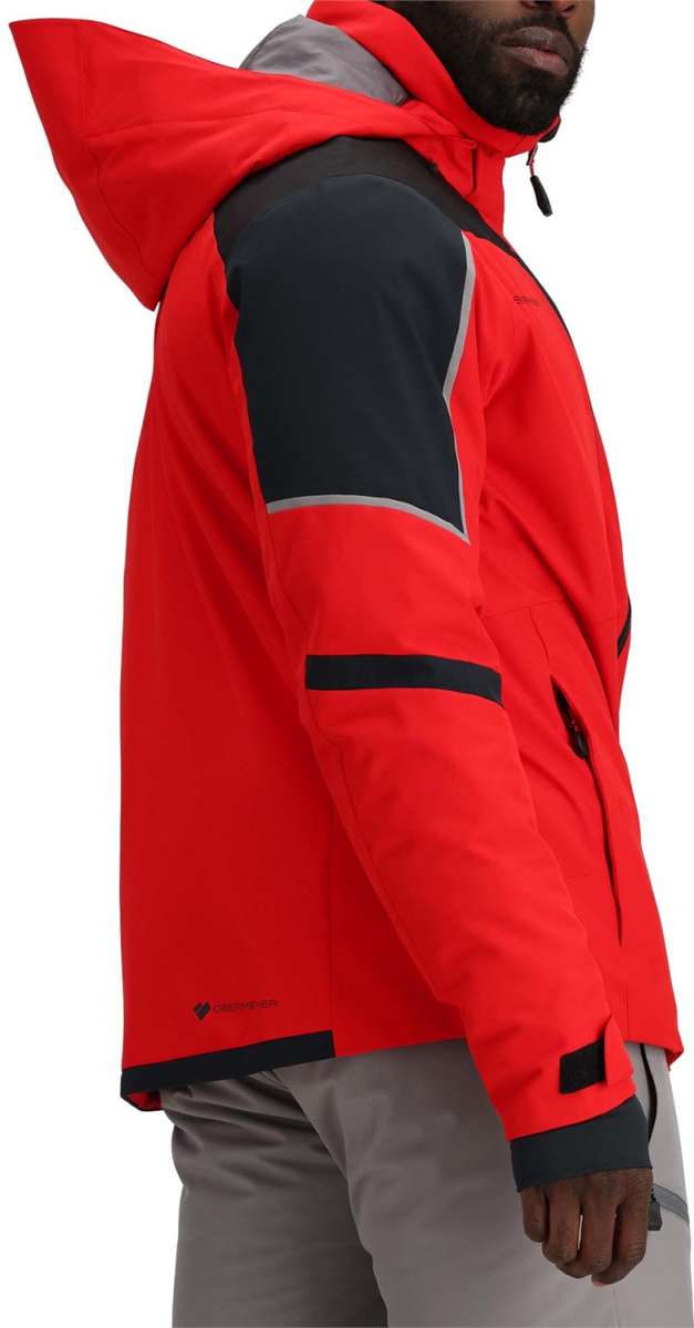 Obermeyer Foundation Insulated Jacket Tall 2024 - A red jacket with a gray hood and black trim, worn by a model from the waist up against a white background.