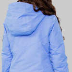 Obermeyer Girls Rylee Insulated Jacket 2022-2023 - A light blue jacket with a hood, featuring a zipper and two pockets on the front.