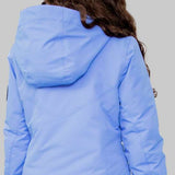 Obermeyer Girls Rylee Insulated Jacket 2022-2023 - A light blue jacket with a hood, featuring a zipper and two pockets on the front.