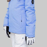 Obermeyer Girls Rylee Insulated Jacket 2022-2023 - Light blue jacket with a hood and black logo patch on the left sleeve.