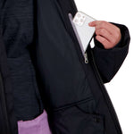 Obermeyer Girls Rylee Insulated Jacket 2022 - A black insulated jacket with a zippered chest pocket and two front pockets, featuring a white logo on the left sleeve.