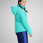 Obermeyer Girls Rylee Insulated Jacket 2024 - A bright turquoise jacket with a high collar and belt, worn by a girl with brown hair in braids.