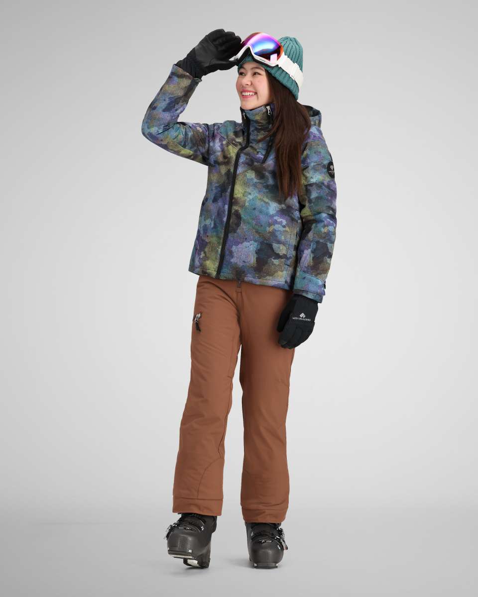 Obermeyer Girls Taja Print Insulated Jacket 2024 - A multicolored abstract floral print jacket with a hood, worn by a model posing in front of a plain background.