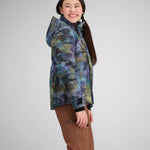 Obermeyer Girls Taja Print Insulated Jacket 2024 - A blue, green, and purple abstract floral pattern on a girl's jacket with a high collar and zippered pockets.