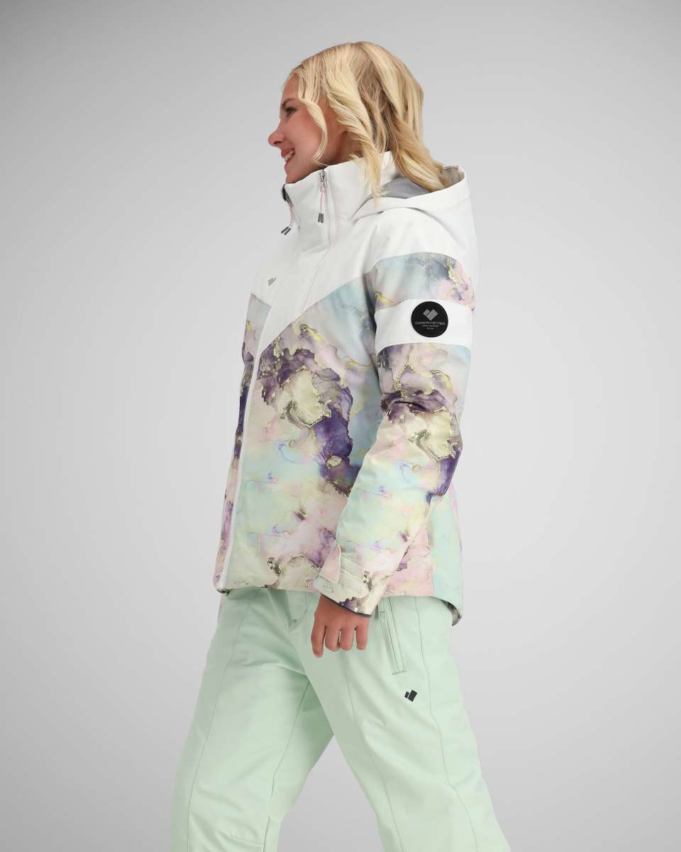 Obermeyer Girls Taja Print Insulated Jacket 2024 - A pastel-colored jacket with a purple and yellow abstract pattern on the front, back, and sleeves.