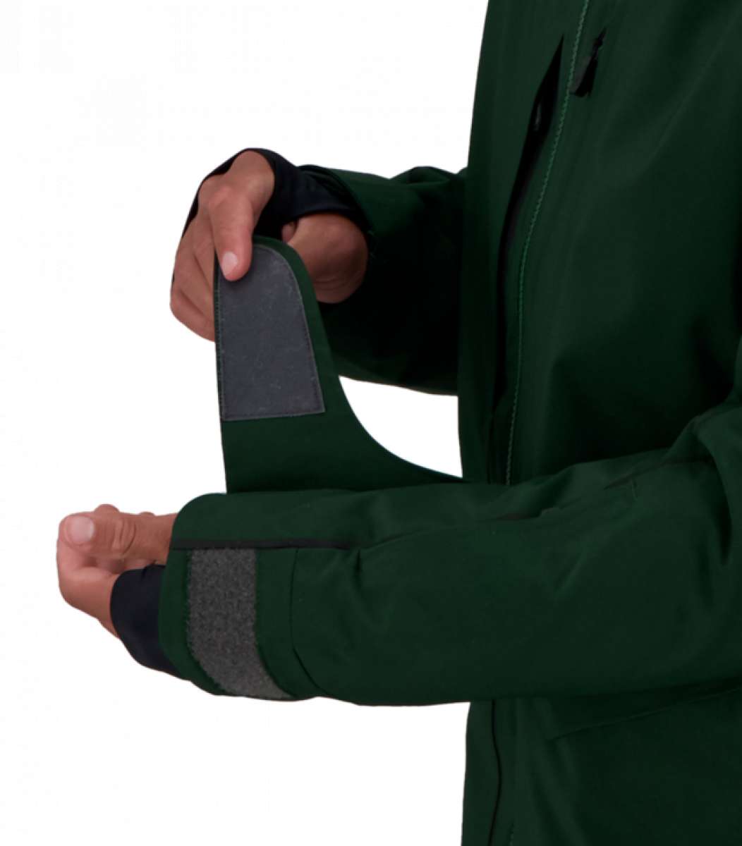 Obermeyer Kodiak Jacket 2022 - A dark green jacket with a black zipper and two zippered pockets on either side.