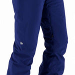 Obermeyer Women's Bliss Insulated Pants Tall 2024 - Dark blue pants with zippered pocket on left hip and reflective square logo near right knee.