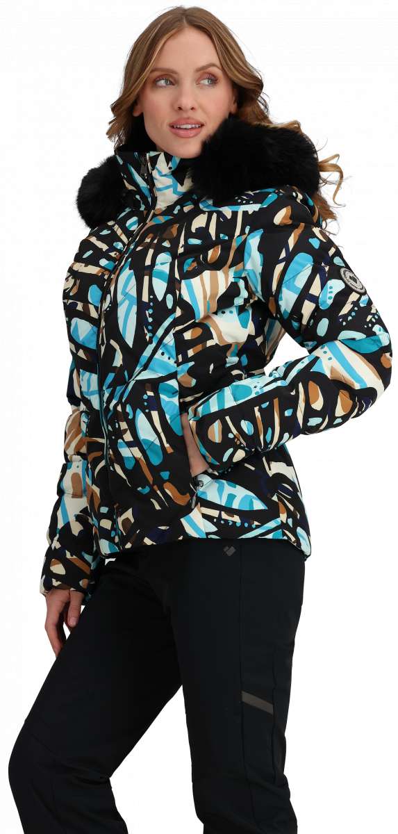 Obermeyer Women's Bombshell Down Jacket 2024 - A black down jacket with a blue and brown abstract pattern, featuring a fur-lined hood.