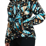 Obermeyer Women's Bombshell Down Jacket 2024 - A black down jacket with a blue and brown abstract pattern, featuring a fur-lined hood.