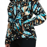 Obermeyer Women's Bombshell Down Jacket 2024 - A black down jacket with a blue and brown abstract pattern, featuring a fur-lined hood.