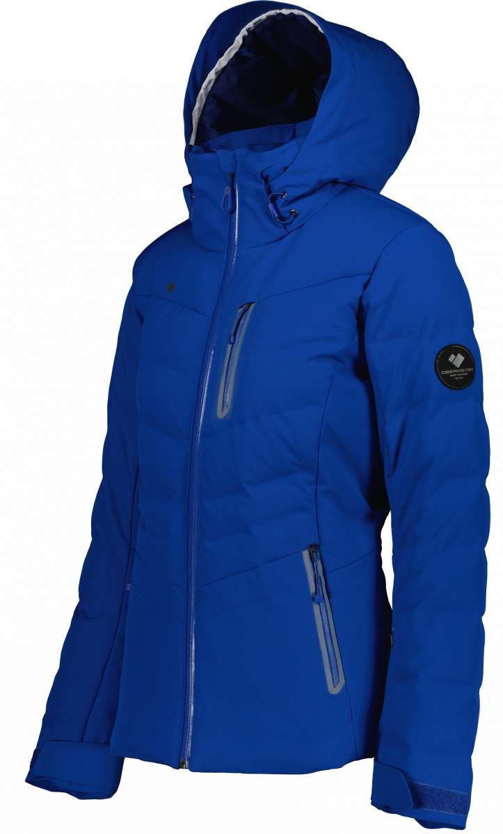 Obermeyer Women's Cosima Down Jacket 2022-2023 - A royal blue down jacket with a hood, featuring two zippered pockets and a black logo on the left chest.