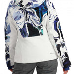 Obermeyer Women's Cosima Down Jacket 2024 - A white down jacket with a blue and black abstract pattern on the back, featuring a hood and zippered pockets.