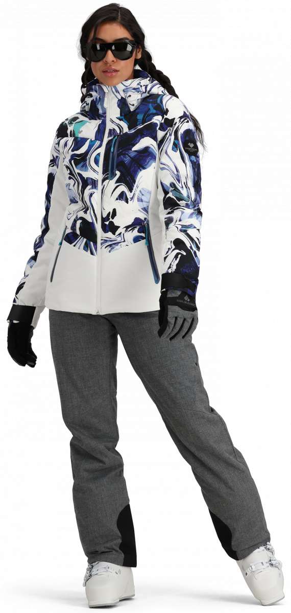 Obermeyer Women's Cosima Down Jacket 2024 - A white down jacket with a blue and black abstract pattern on the front, worn by a model posing in front of a plain background.