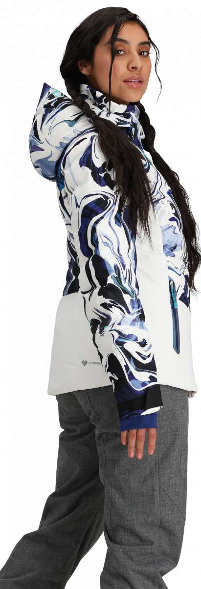 Obermeyer Women's Cosima Down Jacket - A white down jacket with a blue and black abstract pattern on the front, worn by a model from behind.