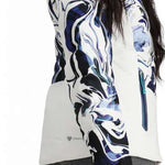 Obermeyer Women's Cosima Down Jacket - A white down jacket with a blue and black abstract pattern on the front, worn by a model from behind.