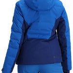 Obermeyer Women's Cosima Down Jacket 2024 - A royal blue down jacket with a darker blue panel on the back and black zippers.