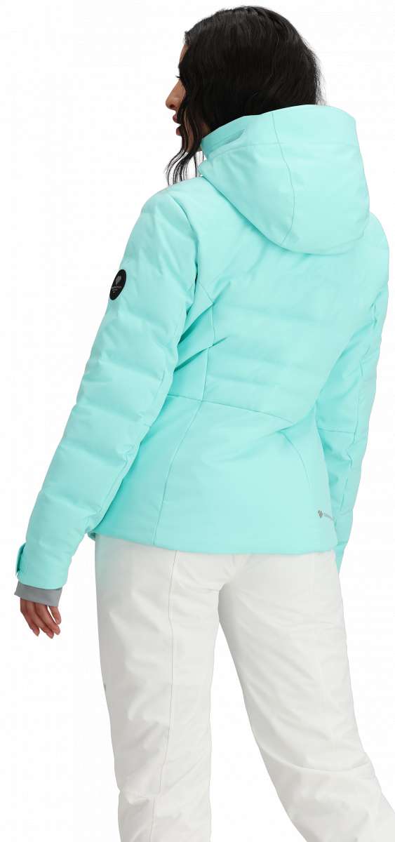 Obermeyer Women's Cosima Down Jacket - A light blue down jacket with a hood and black patch on the left sleeve.