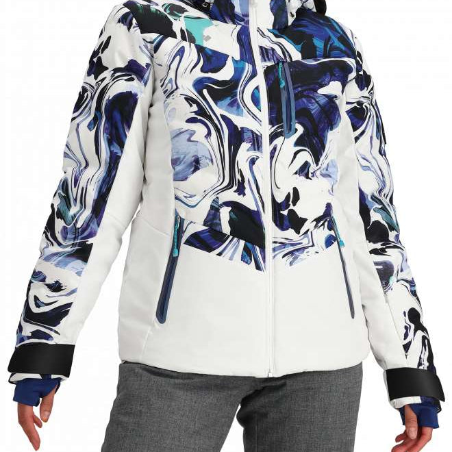 Obermeyer Women's Cosima Down Jacket - A white down jacket with a blue and black abstract pattern on the front, featuring a high collar and zippered pockets.