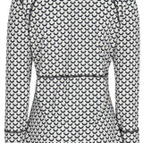 Obermeyer Women's Discover Quarter Zip Top 2024 - A white quarter-zip top with a repeating pattern of black half-moons and black trim along the zipper.