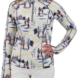 Obermeyer Women's Discover Quarter Zip Top 2024 - A cream-colored zip-up top with a repeating pattern of skiers and trees in red, yellow, blue, gray, and white.