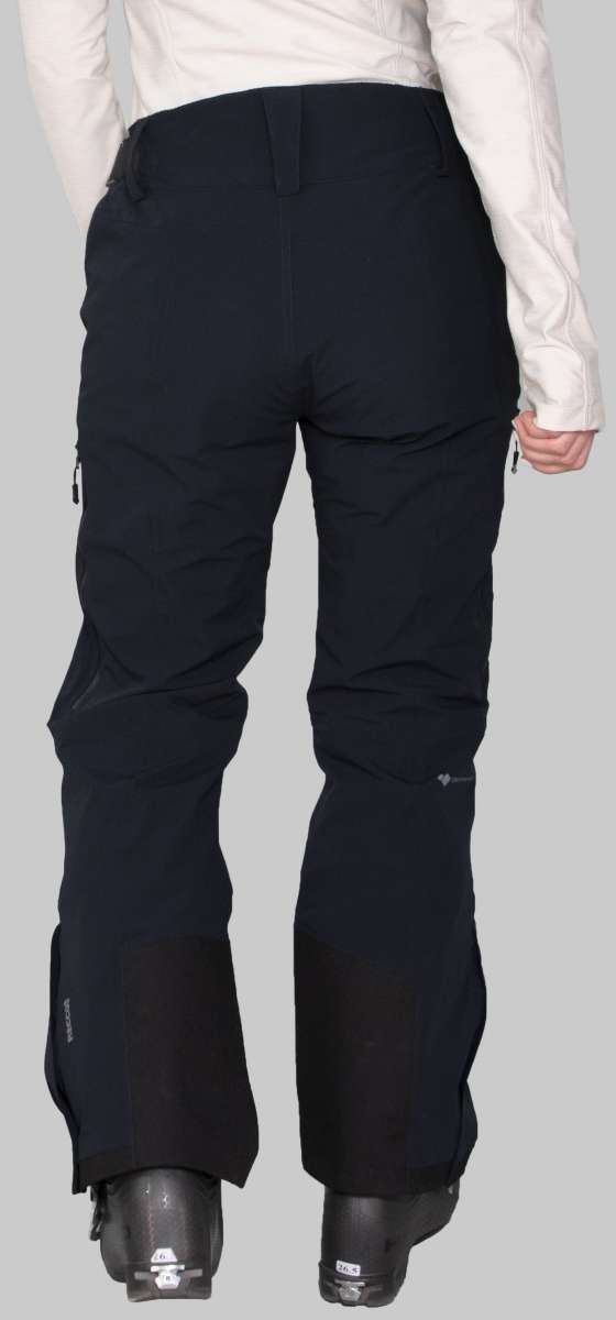 Obermeyer Women's Emily Insulated Pant Short 2023 - Black snow pants with zippered pockets and adjustable waistband, worn by a model from behind.