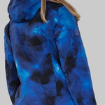 Obermeyer Women's Highlands Shell Jacket - A blue and black jacket with a hood, worn by a woman with long blonde hair.