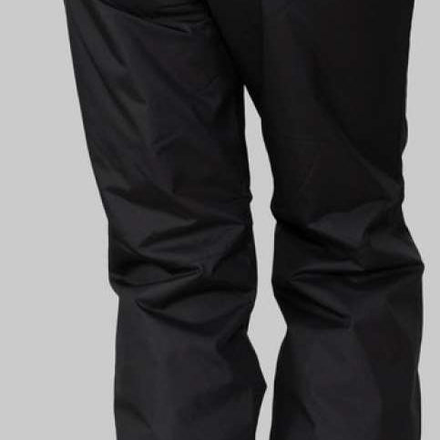 Obermeyer Women's Insulated Sugarbush Pant 2022-2023 - Black insulated ski pants with a subtle pattern of small, light-colored snowflakes on the left thigh.