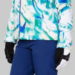 Obermeyer Women's Jette Insulated Jacket 2022-2023 - A white jacket with a blue and green abstract pattern, featuring a high collar and zippered pockets.