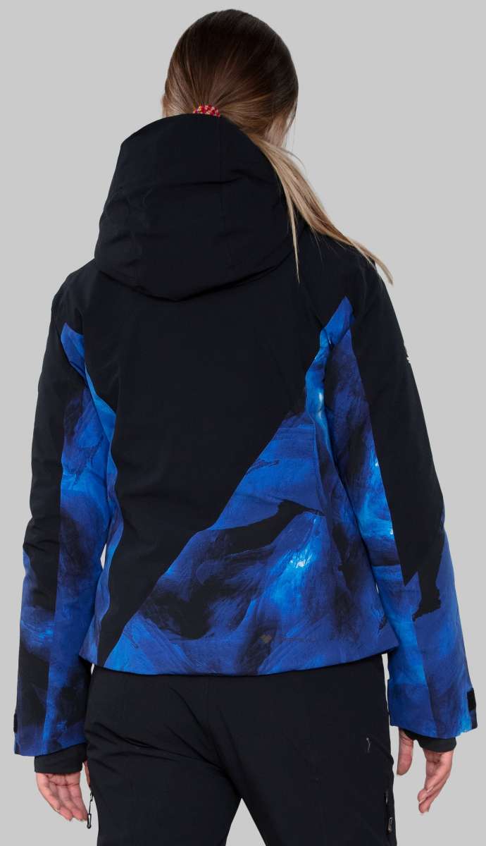 Obermeyer Women's Kayla Insulated Jacket Petite 2022-2023 - A black jacket with a blue and black abstract pattern on the back, worn by a model facing away from the camera.