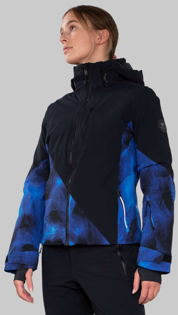 Obermeyer Women's Kayla Insulated Jacket Petite 2022-2023 - A black and blue patterned jacket with a high collar, worn by a model from the waist up.