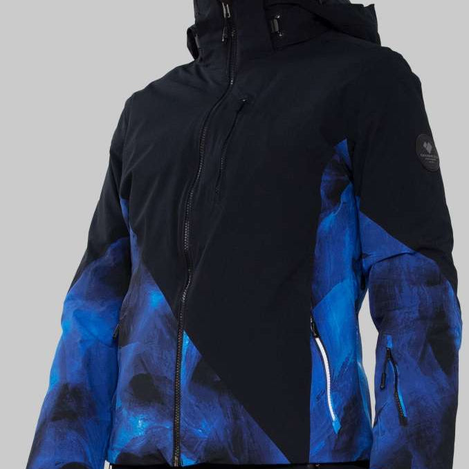 Obermeyer Women's Kayla Insulated Jacket Petite 2022-2023 - A black and blue patterned jacket with a high collar, worn by a model from the waist up.