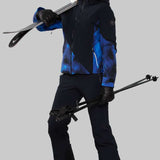 Obermeyer Women's Kayla Insulated Jacket Petite 2022-2023 - A black jacket with a blue and white pattern on the front, worn by a model.