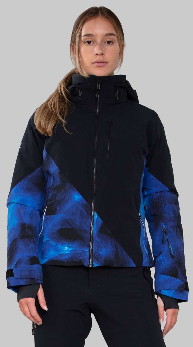 Obermeyer Women's Kayla Insulated Jacket Petite 2022-2023 - A black and blue abstract patterned jacket with a high collar, worn by a model with long brown hair in a ponytail.
