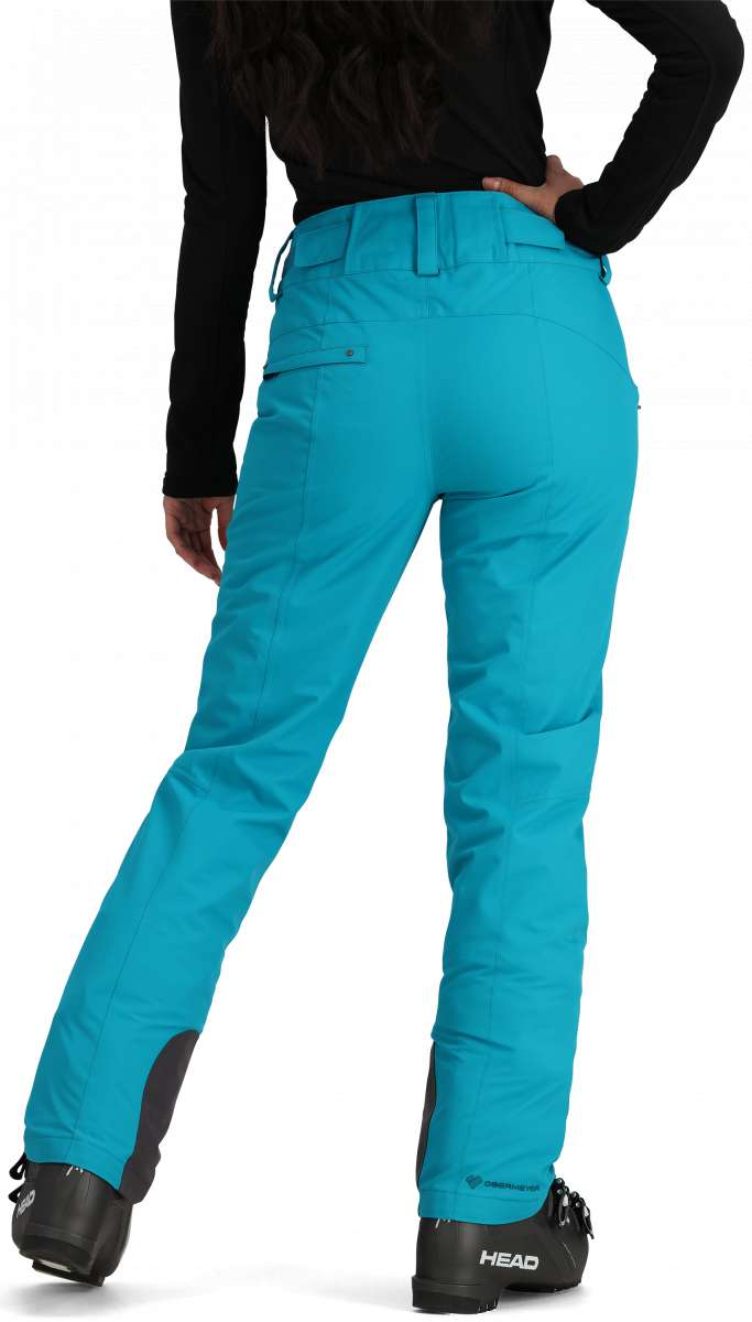 Obermeyer Women's Malta Insulated Pant 2024 - A pair of bright blue snow pants with a zippered pocket on the side and adjustable velcro straps at the waist.