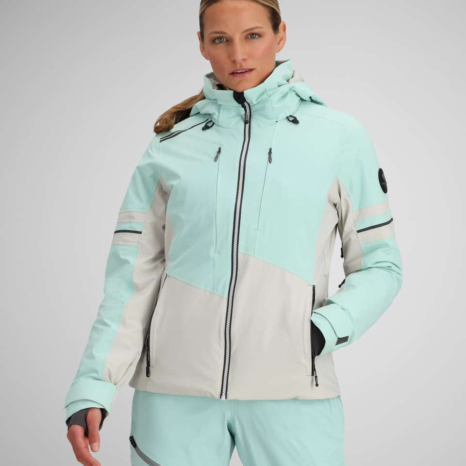 Obermeyer Women's Platinum Insulated Jacket 2024 - A light blue and white jacket with a hood, zipper closure, and two zippered pockets on the front.