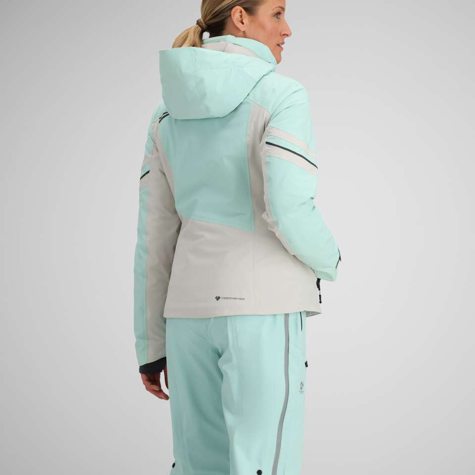 Obermeyer Women's Platinum Insulated Jacket 2024 - A light blue and white jacket with a hood, featuring black zippers on the chest and sleeves.