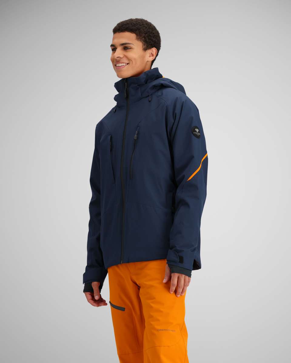 Obermeyer Raze Insulated Jacket 2024 - A navy blue jacket with a black zipper and two zippered pockets on either side.