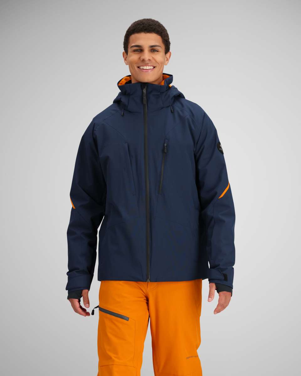 Obermeyer Raze Insulated Jacket 2024 - A navy blue jacket with orange accents on the inside of the hood and zipper.