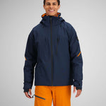 Obermeyer Raze Insulated Jacket 2024 - A navy blue jacket with orange accents on the inside of the hood and zipper.