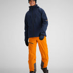 Obermeyer Raze Insulated Tall Jacket 2024 - A navy blue jacket with a black zipper and two zippered pockets on the front.