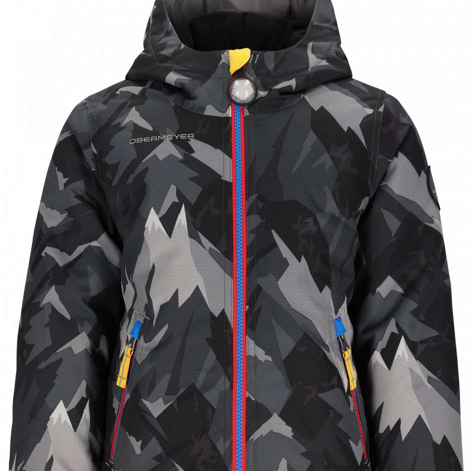 Obermeyer Youth Ashor Insulated Jacket 2024 - A black and grey snowboard jacket with a mountain graphic pattern, featuring yellow zippers and a blue zipper pull on the front.