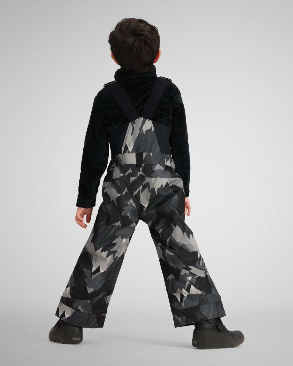 Obermeyer Youth Warp Insulated Bib Pants 2024 - Black bib pants with a geometric pattern of light gray and dark gray triangles on a black background.
