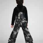 Obermeyer Youth Warp Insulated Bib Pants 2024 - Black bib pants with a geometric pattern of light gray and dark gray triangles on a black background.