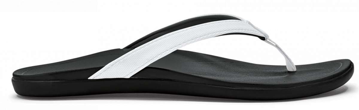 Olukai Ladies Ho'opio Sandals 2022 - A pair of black sandals with white straps and a woven pattern on the strap.