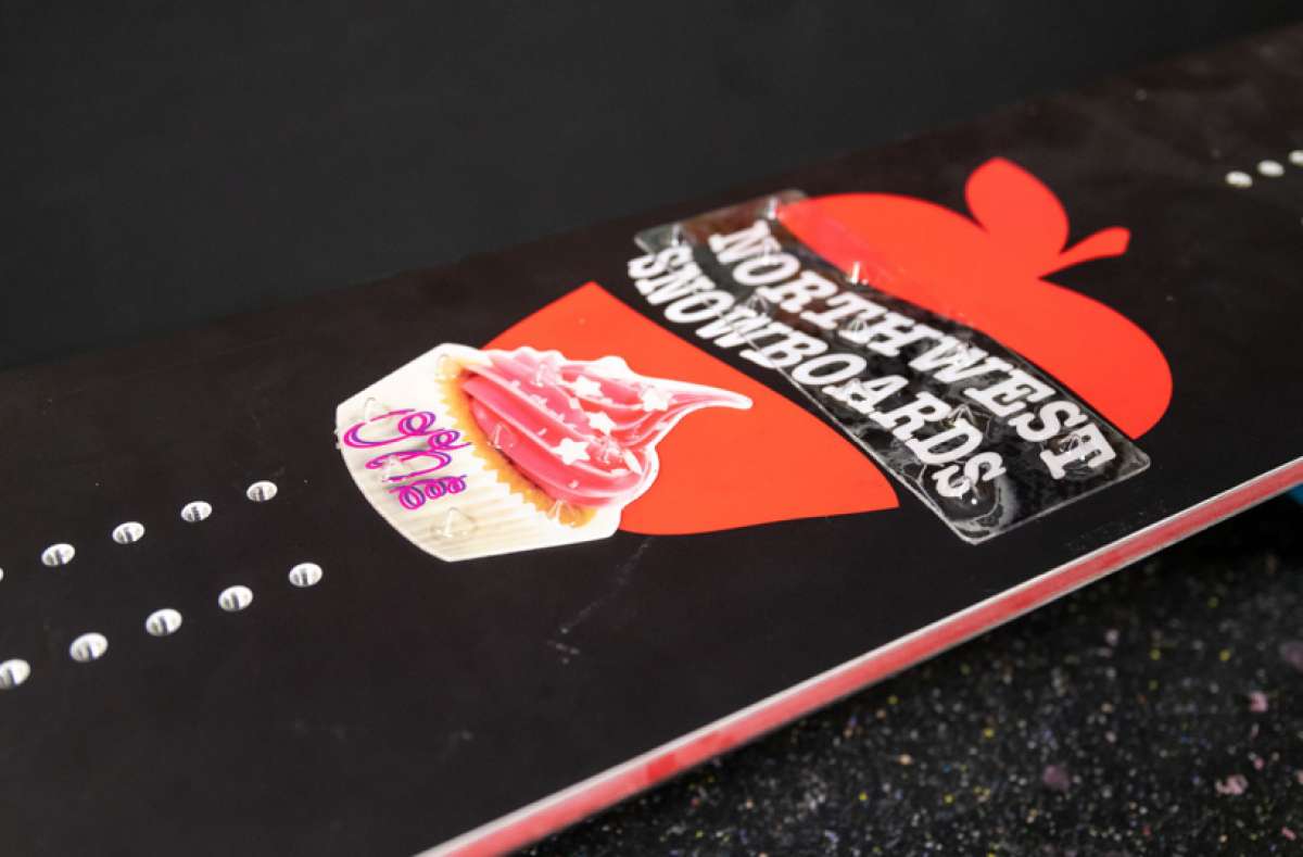 Oneball Cupcake Stomp Pad 2022-2023 - A pink cupcake with white frosting and a single lit candle on top, sitting atop a beige square with cursive writing in purple.