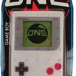 Oneball Game Boy Stomp Pad 2024 - A gray plastic stomp pad with a red button in the center and a white logo that says "ONE" on top.