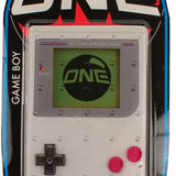 Oneball Game Boy Stomp Pad 2024 - A gray plastic stomp pad with a red button in the center and a white logo that says "ONE" on top.