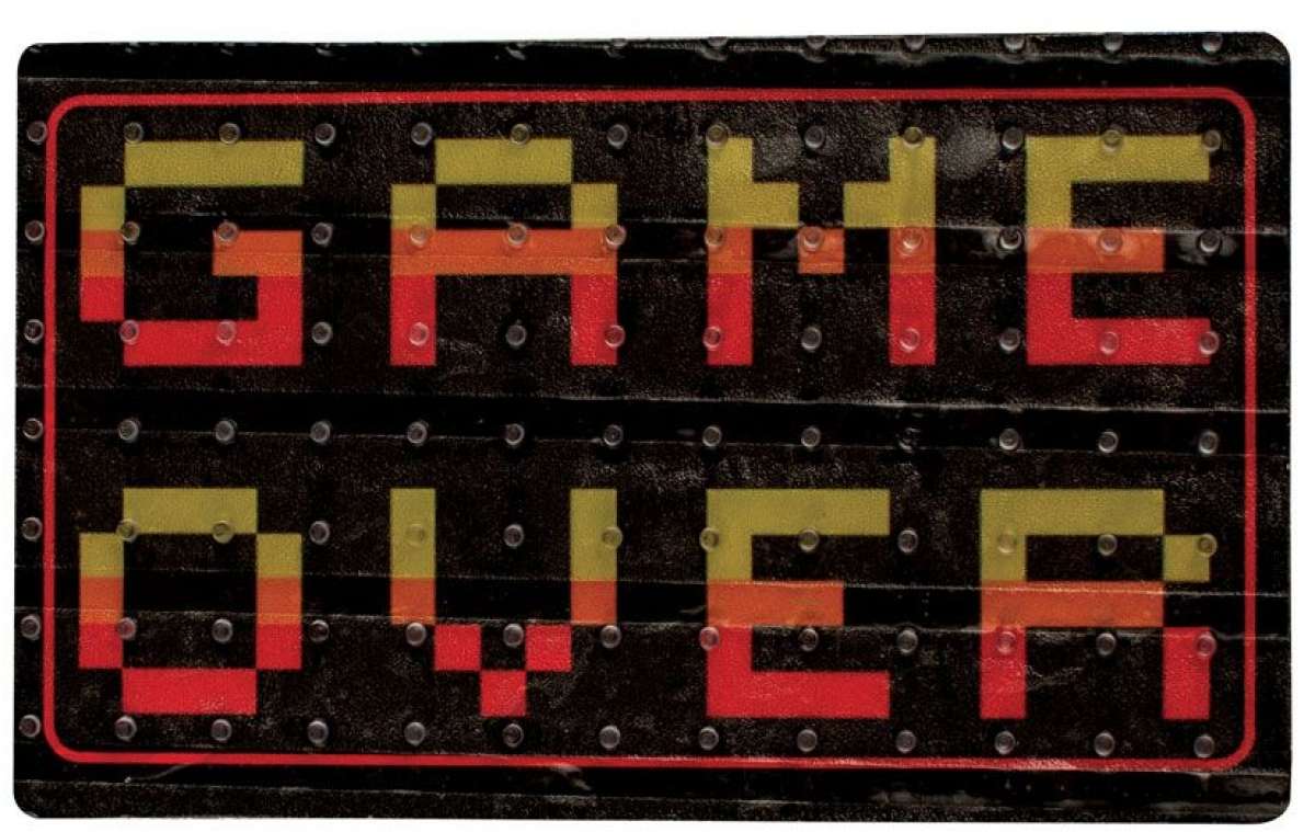 Oneball Game Over Stomp Pad 2024 - A black stomp pad with a pixelated "GAME OVER" design in yellow and red letters.