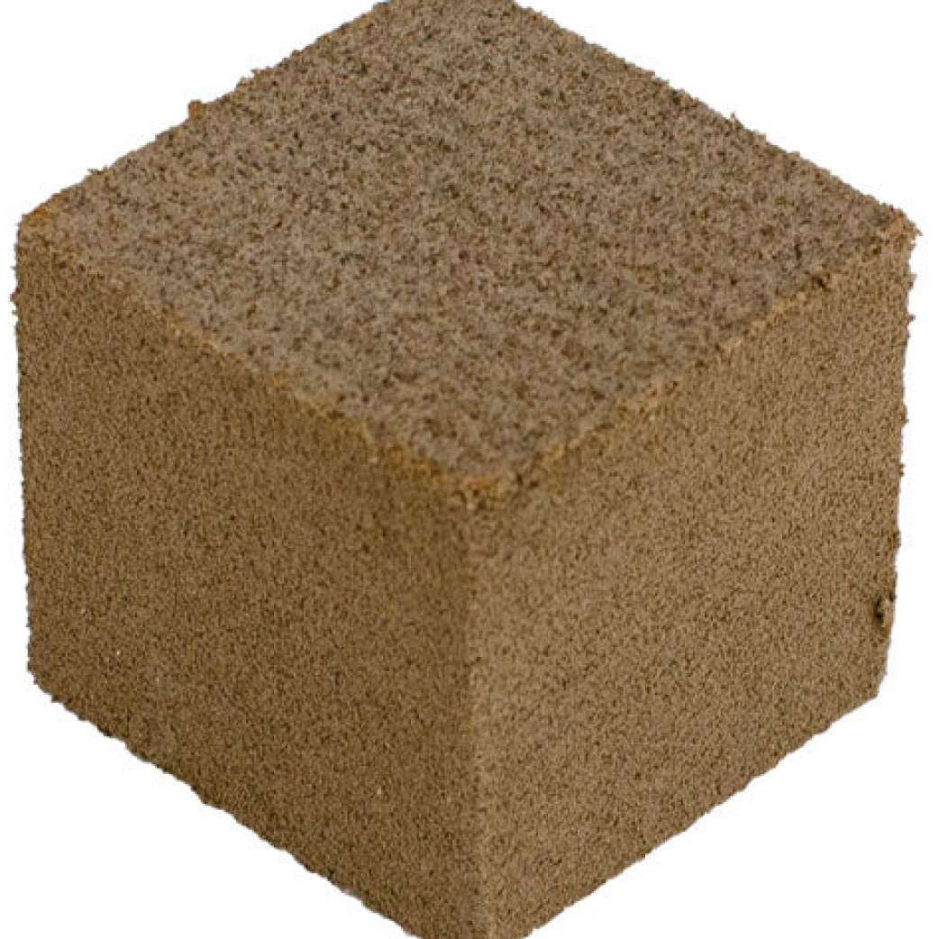 Oneball Gummy Stone 2024 - A brown cube with a rough, porous texture and small holes throughout.